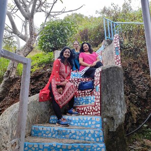 A staircase with mosaic tiles, metal railings, and a natural backdrop. - Tabletop Boutique Resort (Mahabaleshwar)