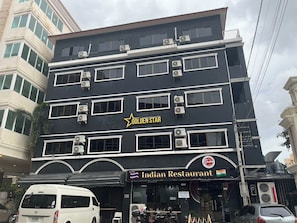A multi-story building with a restaurant named 'Indian Restaurant' on the ground floor. - Golden Star Pattaya (Pattaya)