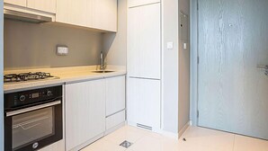 Private kitchen - Fascinating 1BR Apt in Zada Tower (Dubai)