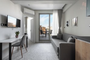 Apartment, 1 Bedroom, Balcony, City View | Living area | 42-inch Smart TV with digital channels - Avenue Studios & Apartments, Nilie Hospitality MGMT (Thessaloniki)