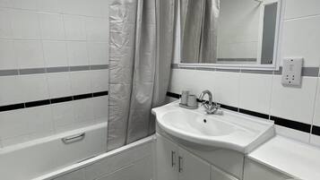 Apartment | Bathroom | Combined shower/tub, deep soaking tub, towels, toilet paper