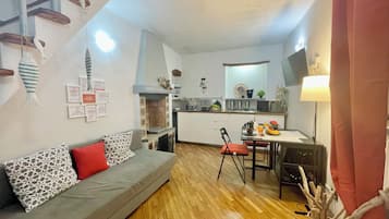 Apartment, Non Smoking | Living area | Flat-screen TV