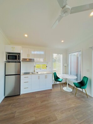 Fridge, microwave, stovetop, coffee/tea maker