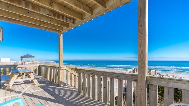 A wooden deck with a view of the ocean, a gazebo, and a picnic table. - Fair Winds - Oceanfront (Surf City)