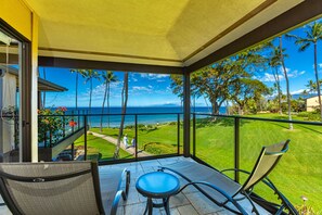 A balcony with a view of the ocean and palm trees. - Wailea Elua, #1302 1 Bedroom Condo by RedAwning (Kihei)