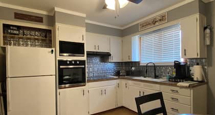 Charming 2-bedroom house in Atchison on quiet brick and tree lined street.