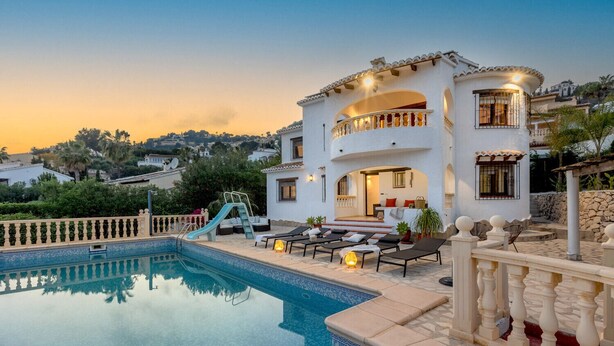 A two-story house with a swimming pool, outdoor seating, and a slide. - Villa PERLA by Abahana Villas (Teulada)