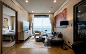 Presidential Suite, 1 Bedroom, Harbour View, Corner | Living area | 65-inch Smart TV with cable channels, Netflix, smart speakers - Odela West Tower Riverside Apt Hotel (Ho Chi Minh City)