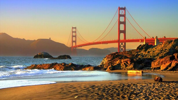 A beach with a prominent red bridge in the background. - Entire Oceanview Coastal Retreat in Pacifica (Pacifica)