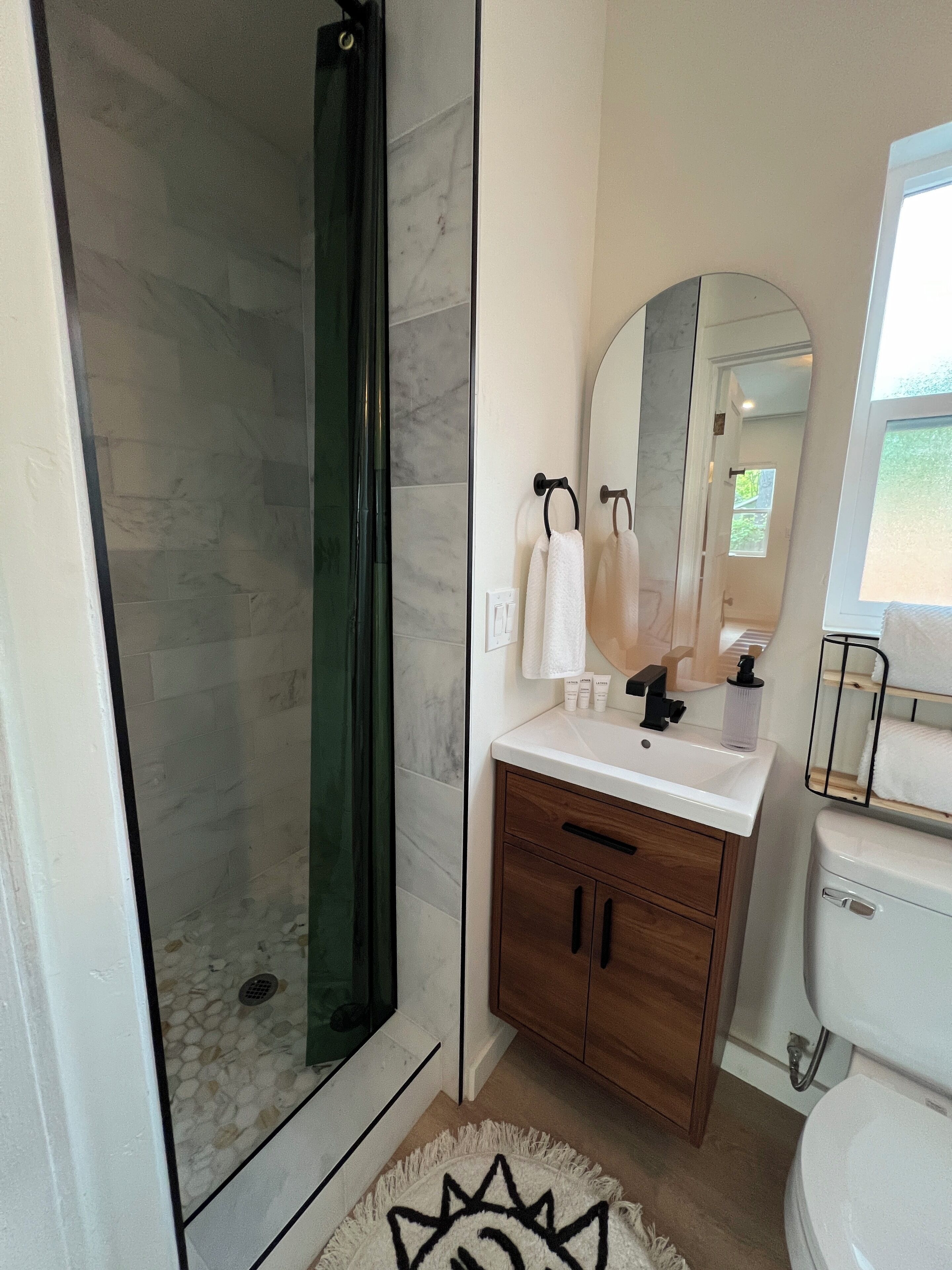 Shower, hair dryer, towels, soap