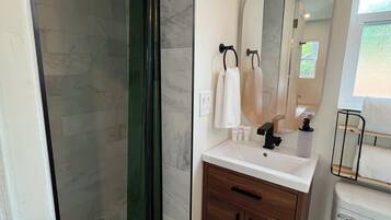 Shower, hair dryer, towels, soap