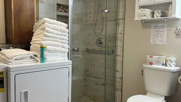 Shower, hair dryer, towels, soap