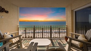 A balcony with a view of the beach and sunset. - NEW! Salt Life at PCB (Panama City Beach)