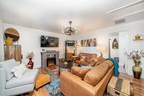 TV, fireplace, books, printers