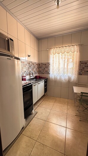Classic Quadruple Room | Private kitchen | Coffee/tea maker
