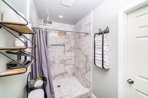 Shower, hair dryer, towels, soap