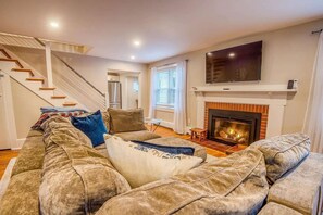 TV, fireplace, books, offices