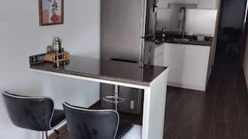 Fridge, microwave, stovetop, coffee/tea maker