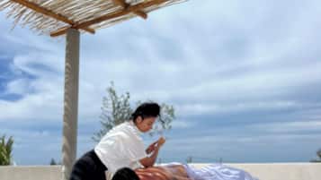 Guests can enjoy soothing massages in a serene outdoor setting.