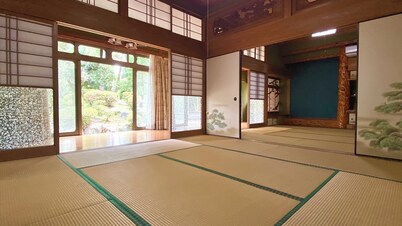 A whole old minka house in a natural setting with an open-air bath