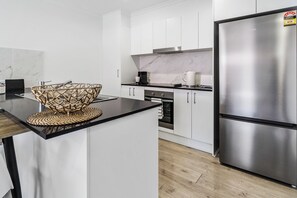 Fridge, microwave, oven, stovetop - Bellbird Park Stay Rosemary |
 3 BR Family and Worker Home (Bellbird Park)