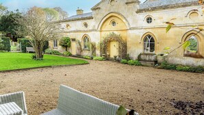 A historic building with arched windows and a courtyard.