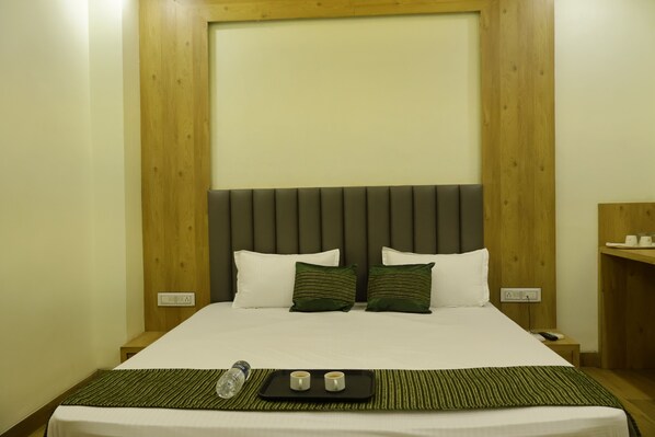 Premium bedding, pillow-top beds, desk, laptop workspace