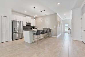 Fridge, microwave, oven, stovetop - Brand New Home 5 Bedrooms/4 Baths At Storey Lake (Kissimmee)