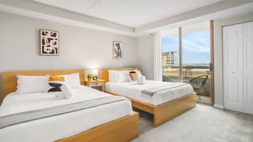 Premium bedding, desk, laptop workspace, iron/ironing board