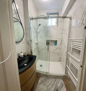 Shower, hair dryer, towels, soap