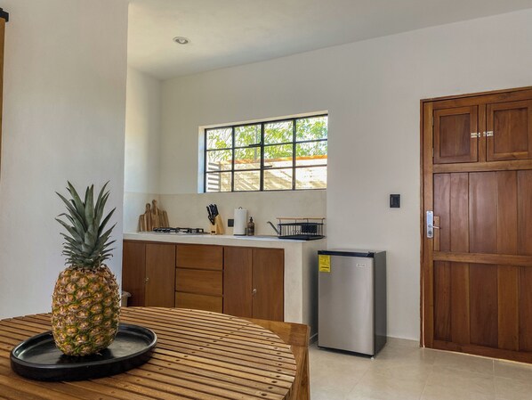 Fridge, microwave, stovetop, coffee/tea maker