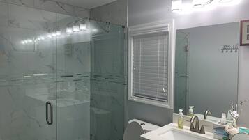 Shower, hair dryer, towels, soap