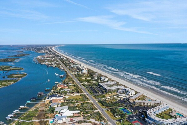 An aerial view of a coastal area with a beach, marina, and buildings. - Direct Ocean View, Private Washer & Dryer (Saint Augustine Beach Florida)