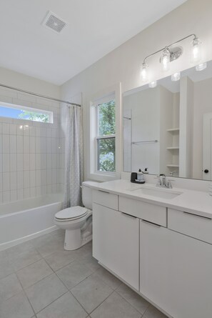 Shower, eco-friendly toiletries, hair dryer, towels