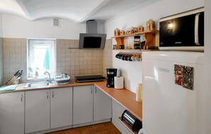 Fridge, coffee/tea maker, cookware/dishes/utensils