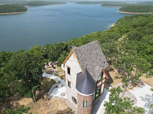 One of a kind Castle on picturesque Skiatook Lake with a Rapunzel exterior look 