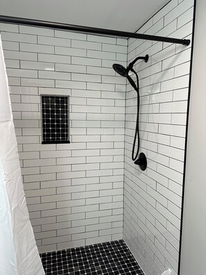 Shower, hair dryer, towels, toilet paper