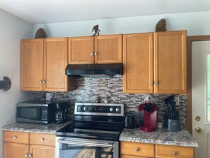 Fridge, microwave, oven, stovetop - Squatch Mountain is a 2-bedroom Cabin for all your "UPNORTH" Fun!  Dog Friendly  (Mountain)