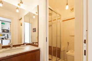 Shower, hair dryer, towels, toilet paper