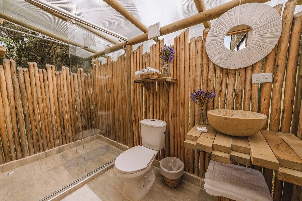 Separate tub and shower, towels, soap, shampoo