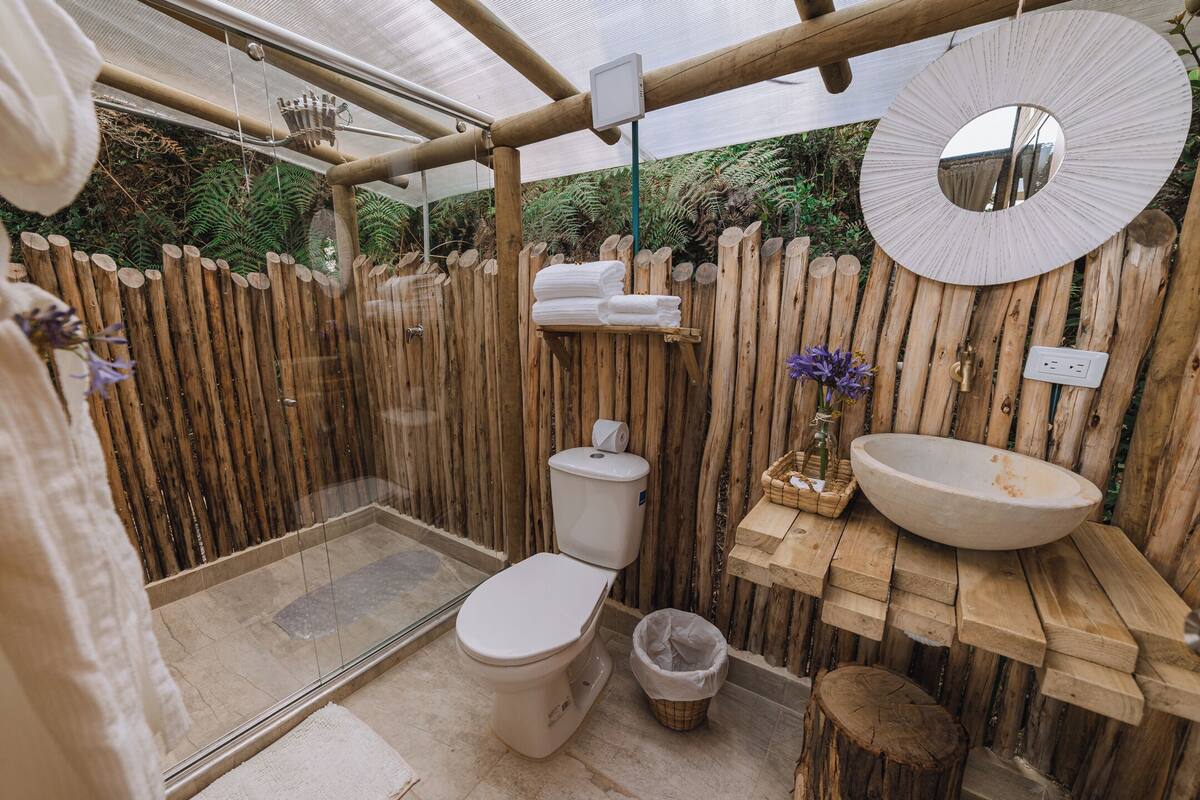 Separate tub and shower, towels, soap, shampoo
