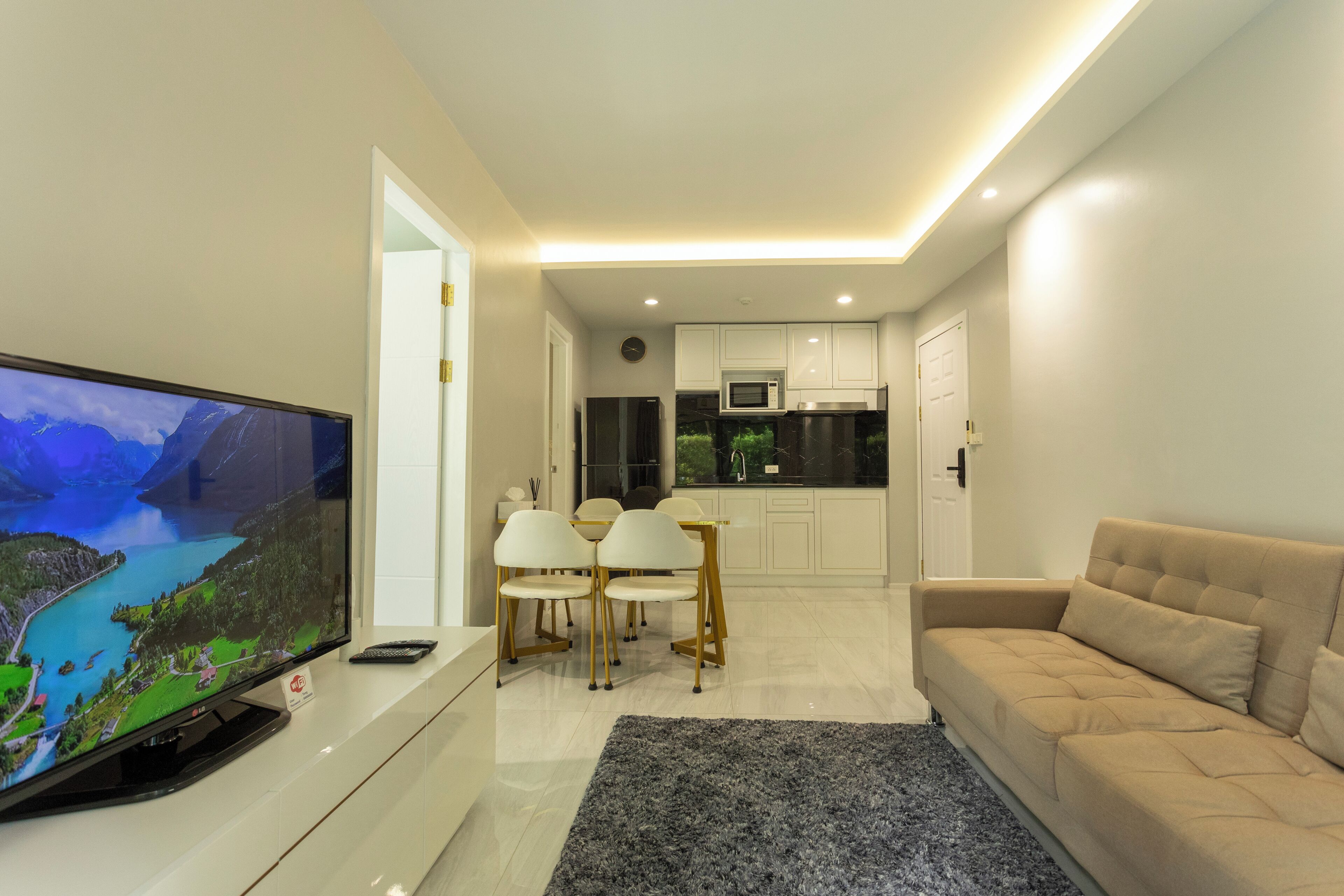 Basic Condo, Pool View | Living area | Flat-screen TV