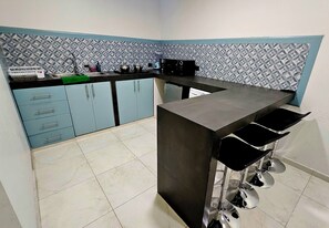 Fridge, microwave, stovetop, coffee/tea maker