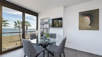 Luxury Apartment, Sea View | Living area | 50-inch TV with cable channels