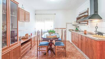 Fridge, stovetop, dishwasher, coffee/tea maker