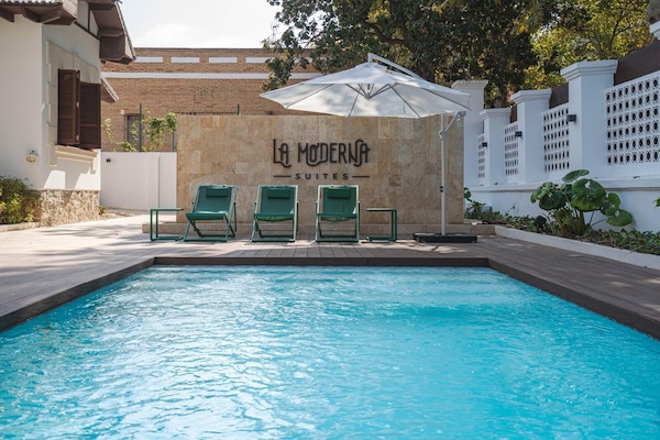 Outdoor pool, open 10:00 AM to 10:00 PM, pool umbrellas, pool loungers