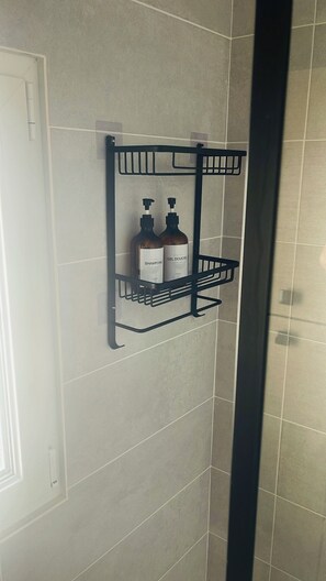 Shower, hair dryer, towels, soap