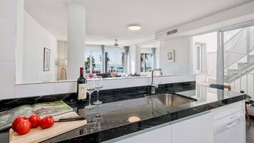 Apartment, Sea View | Private kitchen | Electric kettle, toaster, highchair