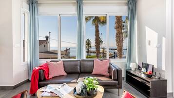 Apartment, Sea View | Living area | TV