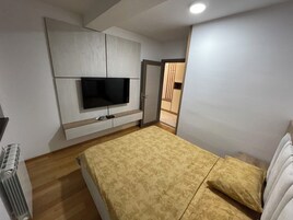 Deluxe Apartment, Balcony | 2 bedrooms, desk, laptop workspace, iron/ironing board
